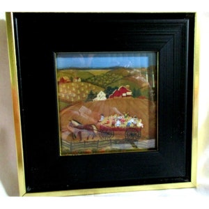May include: A framed painting depicting a horse-drawn wagon filled with children traveling through a rural landscape. The wagon is pulled by two horses and is traveling along a dirt road. The background features a farm with a red barn and a white farmhouse. The painting is done in a naive style with bright colors and simple shapes.