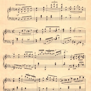 May include: A sheet music score for the song "I Kiss Your Hand, Madame" by Fritz Rotter and Ralph Erwin. The music is written in a traditional style with a key signature and time signature. The title of the song is printed in large, bold letters at the top of the page. The composer's names are printed below the title. The music is arranged for piano and includes a melody line, chords, and lyrics.
