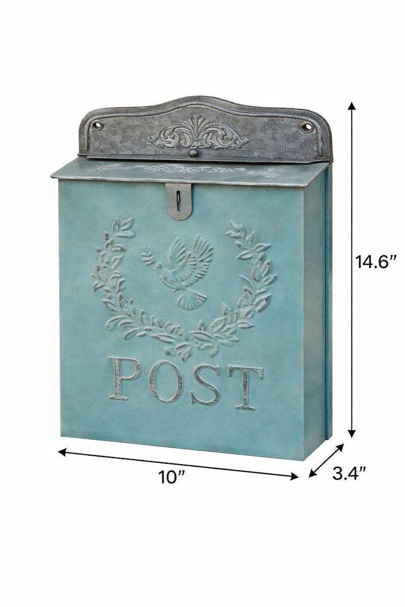 May include: A blue mailbox with a decorative dove and wreath design. The mailbox is 10 inches wide, 3.4 inches deep, and 14.6 inches tall. The word "POST" is embossed on the front.