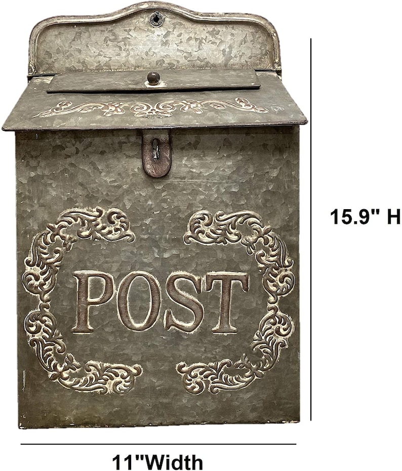 May include: A galvanized metal wall-mounted mailbox with a hinged lid and a decorative embossed frame surrounding the word POST. The mailbox features a weathered gray finish and measures 15.9 inches in height and 11 inches in width.