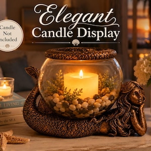 May include: An elegant candle display featuring a bronze mermaid base supporting a glass bowl. Inside, a lit candle rests among pebbles and greenery. The words "Elegant Candle Display" are at the top. A small candle and seashells are also visible.