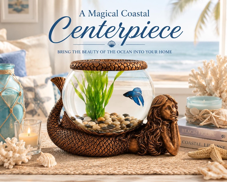 May include: A decorative mermaid-shaped aquarium with a clear glass bowl, housing a blue betta fish and green plants. The base is bronze-colored, and the text reads "A Magical Coastal Centerpiece".