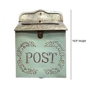 May include: A light green metal wall-mounted mailbox with a galvanized silver top lid. The front features the embossed word POST surrounded by decorative scrollwork. It measures 15.9 inches in height and 11 inches in length as indicated.