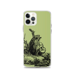 May include: A green iPhone case with a black and white illustration of a frog playing a guitar. The frog is sitting on a lily pad and there are reeds in the background.