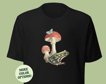 Frosch-Pilz- und Schmetterlingskomposition Unisex-T-Shirt, Cottagecore-Ästhetik-Kröte, niedliches botanisches Arrangement von Phrog, Fliegenpilzmotte