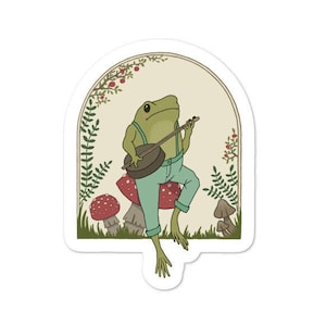 Cute Cottagecore Aesthetic Frog Playing Banjo on Mushroom, Toad Sitting on Mushroom Bubble-free stickers