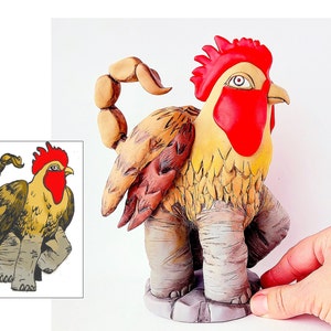 May include: A ceramic sculpture of a rooster with a scorpion tail. The rooster is yellow with a red comb and wattle. The scorpion tail is brown and curled. The sculpture is standing on a brown base.