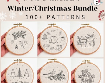 May include: A collection of six embroidery hoop patterns featuring winter and Christmas themes. The patterns include a gingerbread house, a cardinal on a branch, a Christmas tree, a wintery scene with a mug of hot chocolate, a wintery scene with a hat, sweater, and socks, and a wintery scene with a gingerbread man, candy cane, and a mug.