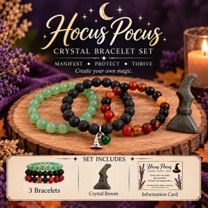 May include: A Hocus Pocus crystal bracelet set featuring three beaded bracelets, a small crystal broom, and an information card. The bracelets include green, black lava, and red-toned beads, with a silver-toned witch hat and green charm.