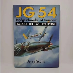 May include: Book cover with a blue and green fighter plane in the sky. The title is "JG 54 Jagdgeschwader 54 Grünherz Aces of the Eastern Front" and the author is "Jerry Scutts".