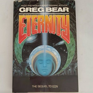 May include: A paperback book titled "Eternity" by Greg Bear. The cover features a vibrant design with the title in orange and red, a blue face within a planet, and a space scene. The text "The Sequel to Eon" is also visible.