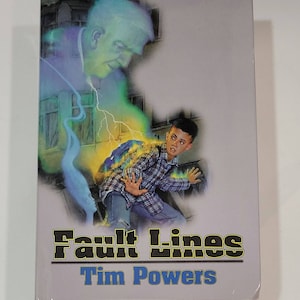 May include: A book cover with a blue and yellow illustration of a young boy being chased by a translucent figure. The title of the book is "Fault Lines" by Tim Powers.