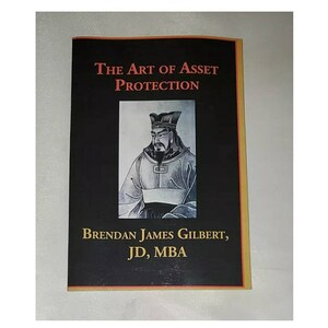 May include: A black and gold book titled "The Art of Asset Protection" by Brendan James Gilbert, JD, MBA. The cover features a black and white illustration of a man in traditional Chinese clothing.