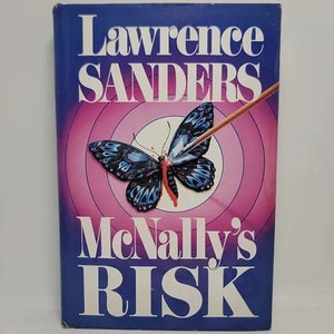 May include: A book cover with a blue background and a butterfly with a red arrow through it. The title is "McNally's Risk" by Lawrence Sanders.