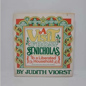 May include: A vintage book cover titled "A Visit From St. Nicholas" by Judith Viorst. The cover features a decorative border in red, green, and gold, with the title in large, stylized lettering. The book is a holiday-themed item.