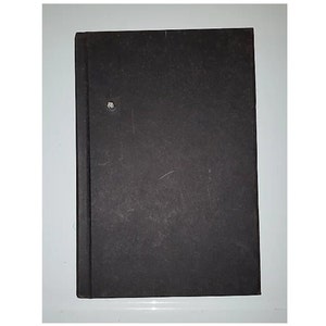 May include: A black hardcover book with a slightly worn appearance.
