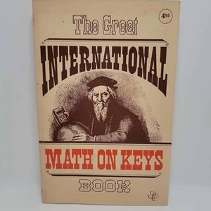 May include: A vintage book cover with a tan background. The title is "The Great International Math on Keys Book". The cover features a drawing of a man with a beard and a calculator. The price is 495.