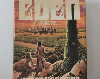 May include: A book cover with a sunset background and the title "West of Eden" in large, bold letters. The author's name, "Harry Harrison", is printed in white letters at the bottom of the cover.