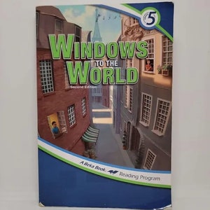 May include: A blue and green book cover with the title "Windows to the World" in white text. The book is a second edition and is part of the A Beka Book Reading Program. The cover features an illustration of a street scene with buildings and windows.