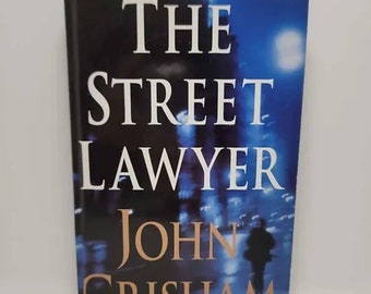 The Street Lawyer: A Novel Hardcover – February 16, 1998 by John Grisham #1 New York Times Best Seller • Michael Brock is billing the ho