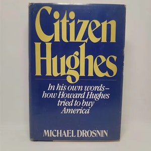 May include: A blue hardcover book with the title "Citizen Hughes" in gold lettering. The subtitle reads "In his own words - how Howard Hughes tried to buy America". The author's name, "MICHAEL DROSNIN", is printed in white at the bottom of the cover.