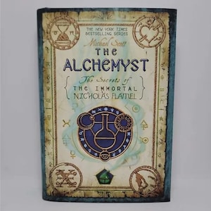 The Alchemyst: The Secrets of the Immortal Nicholas Flamel Hardcover – Deckle Edge, May 22, 2007 by Michael Scott  Book 1 of 6 The Secrets