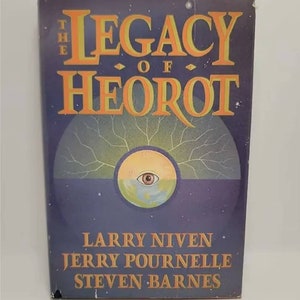 May include: A book cover with a purple background and a yellow and orange title that reads "The Legacy of Heorot". The cover also features a stylized eye with a blue and green planet in the center.