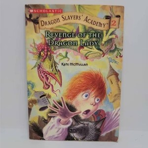 May include: A Scholastic book cover featuring a red-haired boy with a wolf, a dragon, and the title "Dragon Slayers' Academy: Revenge of the Dragon Lady" by Kate McMullan.