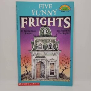 May include: A book cover with a purple and blue background featuring a cartoon illustration of a spooky house with a ghost in the attic. The title of the book is "Five Funny Frights" and the author is Judith Bauer Stamper. The book is part of the "Hello Reader" series, level 4, for grades 2 and 3.