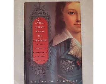 May include: Book cover with a portrait of a young man with a star on his chest. The title is "The Lost King of France: A True Story of Revolution, Revenge, and DNA" by Deborah Cadbury.