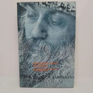 May include: A book cover featuring a close-up of a man's face with a beard. The title of the book is "The Hidden Harmony" by Osho.