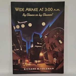 May include: Book cover titled "WIDE AWAKE AT 3:00 A.M. By Choice or by Chance?" featuring a nighttime cityscape with clocks and an airplane. The author's name, RICHARD M. COLEMAN, is at the bottom. The cover has a dark blue and black background.
