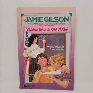 May include: A book cover with a purple background and the title "Thirteen Ways To Sink A Sub" in white text. The author is Jamie Gilson. The cover features an illustration of three children in a classroom setting. A girl is writing on a chalkboard, and two boys are playing with a paper airplane.