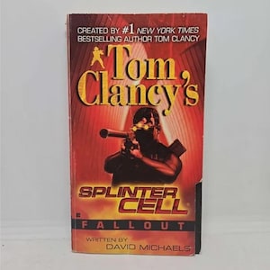 May include: A book cover for the novel "Splinter Cell: Fallout" by Tom Clancy. The cover features a man in black holding a gun, with a red and yellow background.