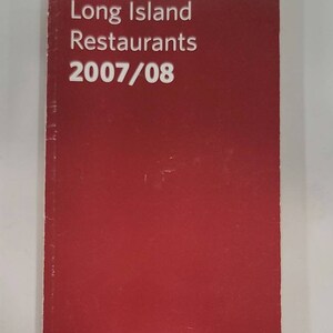 May include: A red Zagat guide for Long Island restaurants, featuring the title "Zagat Long Island Restaurants 2007/08" and the tagline "Including Hamptons hot spots and a listing of noteworthy wineries".