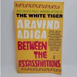 Between the Assassinations Paperback – June 1, 2010 by Aravind Adiga Welcome to Kittur, India. Of its 193,432 residents, only 89 declare