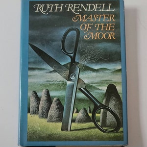 May include: A book cover with a blue background and the title "Master of the Moor" by Ruth Rendell. The cover features a pair of scissors with a dark gray handle and a black blade, partially obscured by a stone circle.
