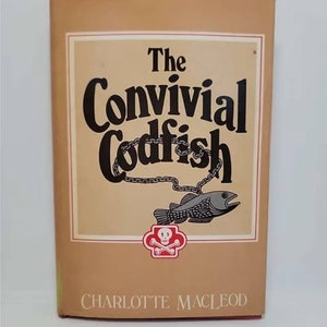 May include: A tan book cover with the title "The Convivial Codfish" in black lettering. The cover features a black and white illustration of a fish with a chain around its neck and a skull and crossbones symbol.