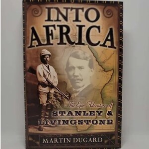 May include: Book cover with a vintage illustration of two explorers in Africa. The title is "Into Africa: The Epic Adventures of Stanley & Livingstone" by Martin Dugard.