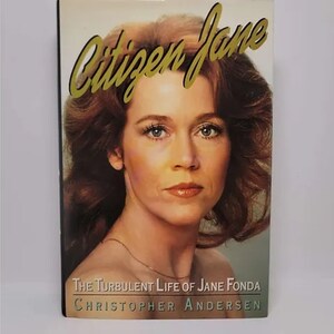 May include: A book titled "Citizen Jane: The Turbulent Life of Jane Fonda" by Christopher Andersen. The cover features a close-up photo of Jane Fonda with long brown hair.