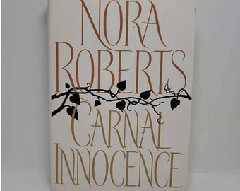 Carnal Innocence Hardcover – July 6, 1999 by Nora Roberts, bestselling author of The Reef and Genuine Lies, mixes scorchin