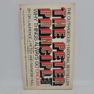May include: A book cover with the title "The Peter Principle" in large, bold, red and gold letters. The subtitle is "Why Things Always Go Wrong" in smaller, black letters. The authors are listed as "Dr. Laurence J. Peter and Raymond Hull".