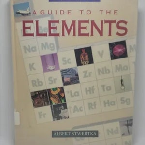 May include: A book titled "A Guide to the Elements" by Albert Stwertka. The cover features a colorful periodic table with images representing each element.
