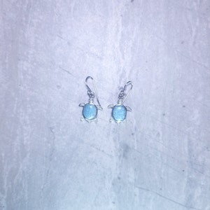 Oval Larimar with turtle designed sterling silver dangle earrings