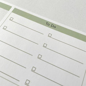 May include: A white to-do list with a green header that says "To Do". There are six blank lines with checkboxes next to each line.