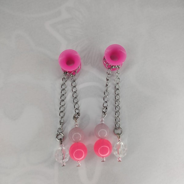 0g hot pink silicone tunnels with handcrafted glass beads and stainless steel chain.