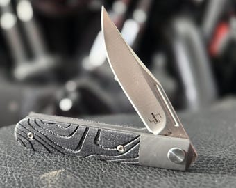 Boker Plus Modern Liner Lock with Micarta scales engraved with Topo Patern.