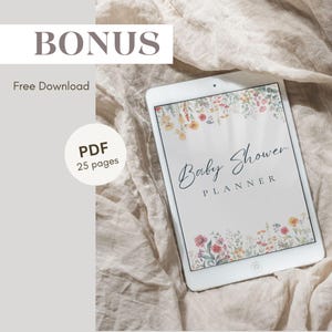May include: A white tablet with a floral design on the screen. The text "Baby Shower Planner" is displayed on the screen. The tablet is lying on a beige fabric surface.
