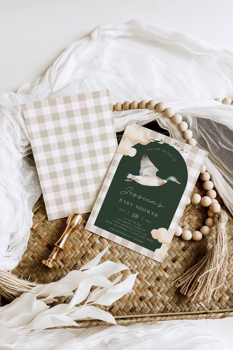 May include: A green and white baby shower invitation with a watercolor illustration of a duck flying in front of a green circle. The text reads "You are invited to Jessica's Baby Shower, Sat 28 Jul, at 07.30 pm, 123 Pretty Sure St, This Amazing City, CA, RSVP to Carol 1 (123) 456-7890, Registered at Target."