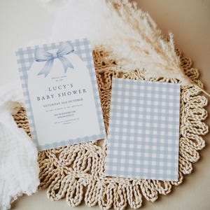 May include: A blue and white gingham baby shower invitation with a blue bow and the text "Lucy's Baby Shower" and "Saturday 16th October".